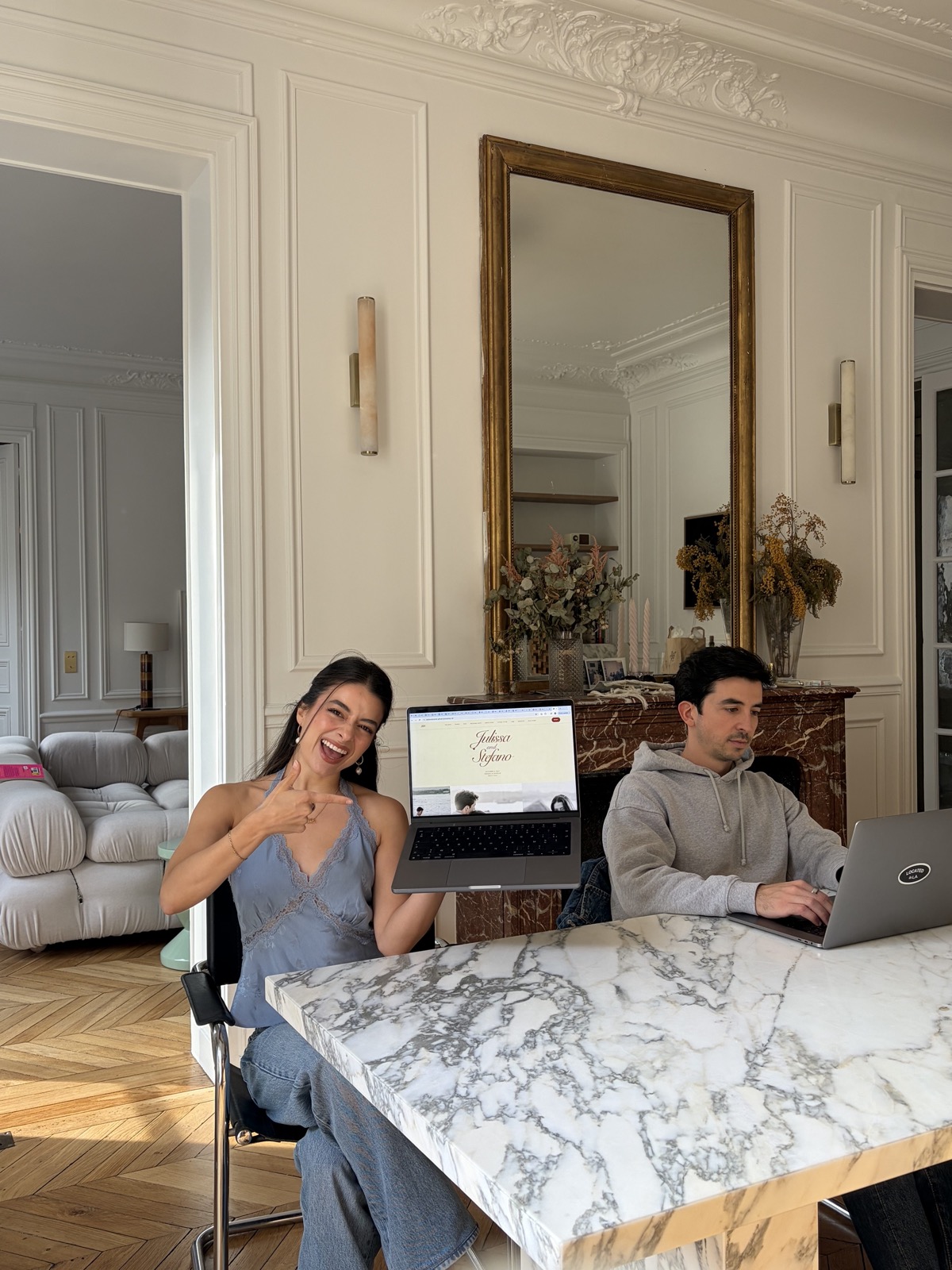 Julissa and Stefano planning their wedding together on their computers